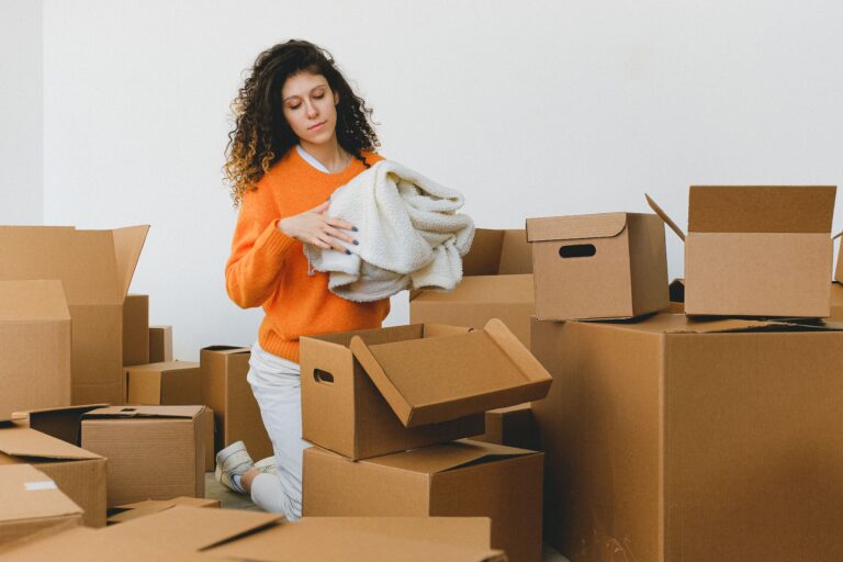 Student packing boxes for the university move