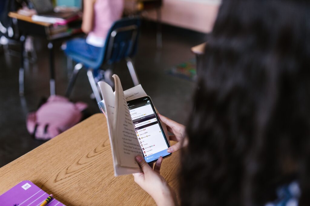 A teenager checking results on a phone