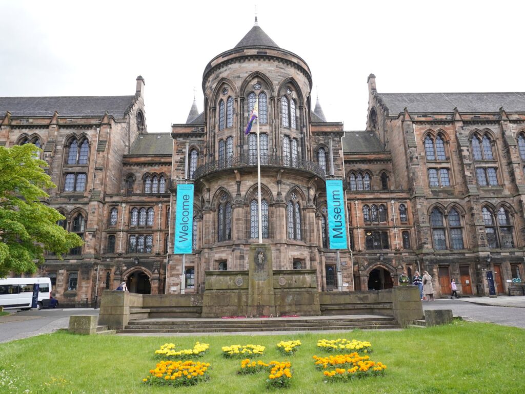 Visitors outside the University of Glasgow main building, which has welcome banners on display