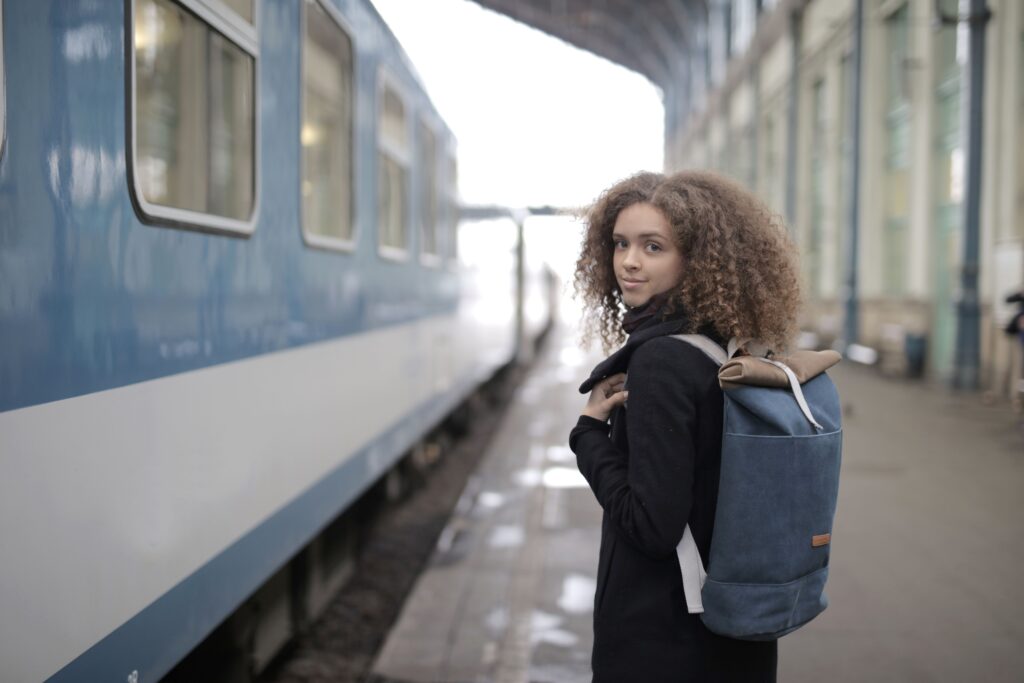 A student waiting on a UK railway platform