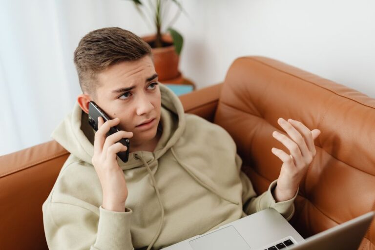 Student waiting on hold on their phone