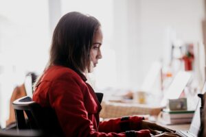 A graduate applicant working through an online assessment on a laptop