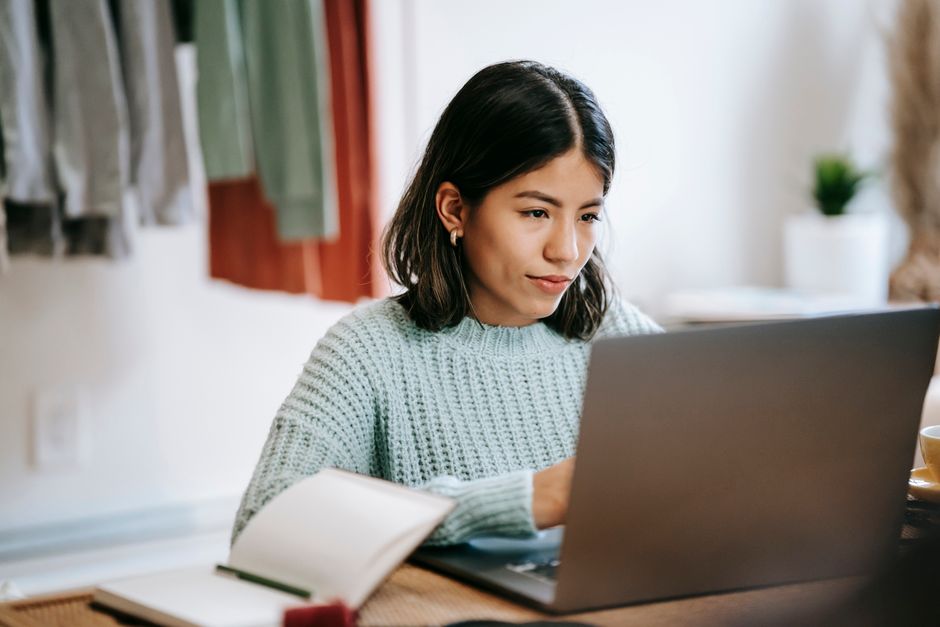 A graduate scheme applicant working through an online assessment on a laptop at home