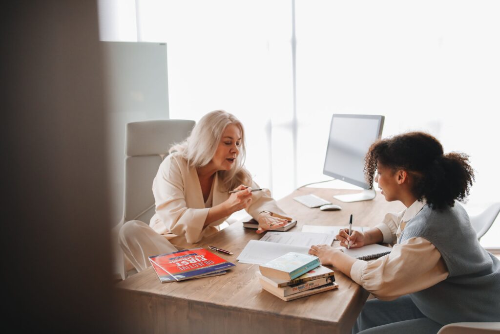 A student meeting a university funding adviser for help with their application
