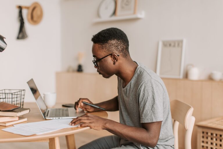 A student filling in an online student finance application on a laptop